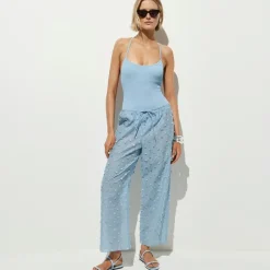 Beach pant with pom-poms