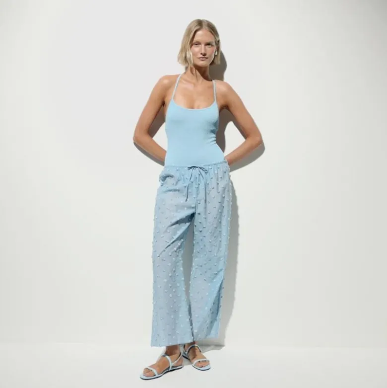 Beach pant with pom-poms