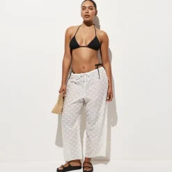 Beach pant with pom-poms