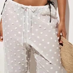 Beach pant with pom-poms