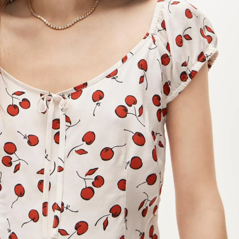 Cap-sleeve top in cherry print