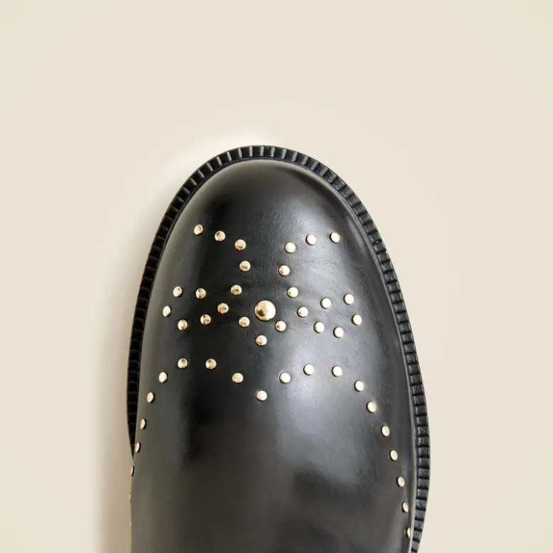 Chelsea wing tip boots in studded leather