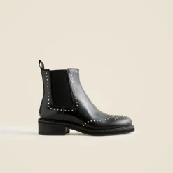 Chelsea wing tip boots in studded leather