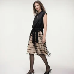 Collection layered mesh skirt with dots