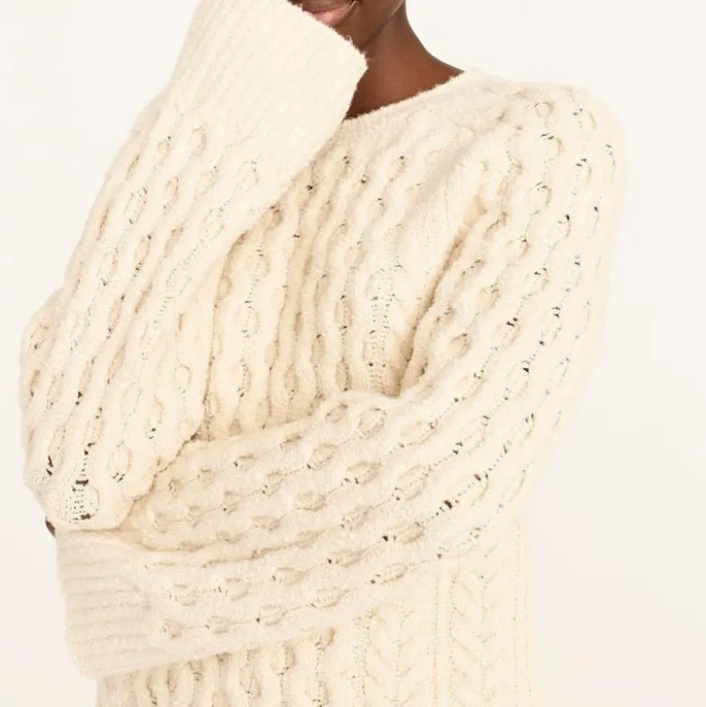 Cotton-blend bouclé cable-knit sweater