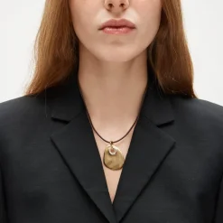 Grommet pendant necklace with leather cord