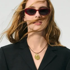 Grommet pendant necklace with leather cord