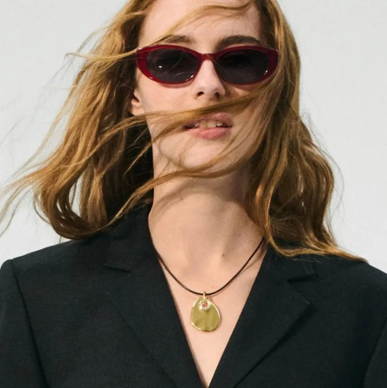 Grommet pendant necklace with leather cord