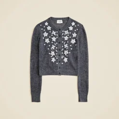 Loose-knit cardigan with floral embellishments